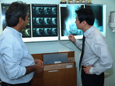 Dr Yoon Jeon examining scan results
